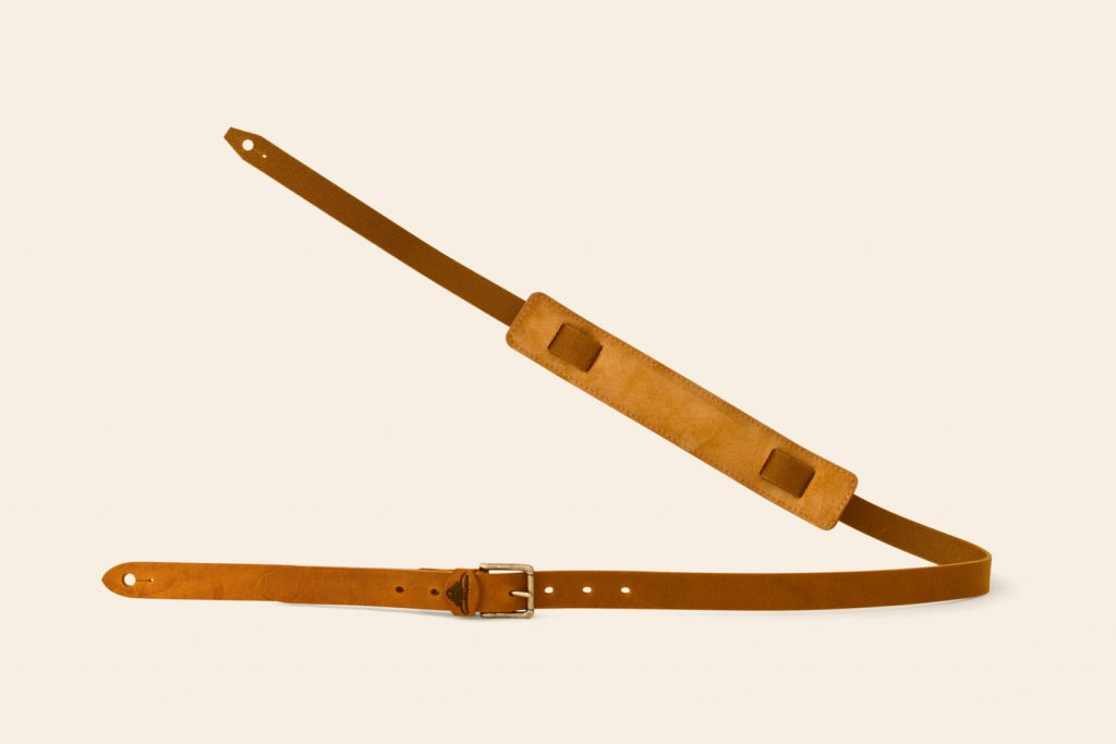 Arch Tor guitar strap in tan leather with Ochre suede and an Antique Brass buckle