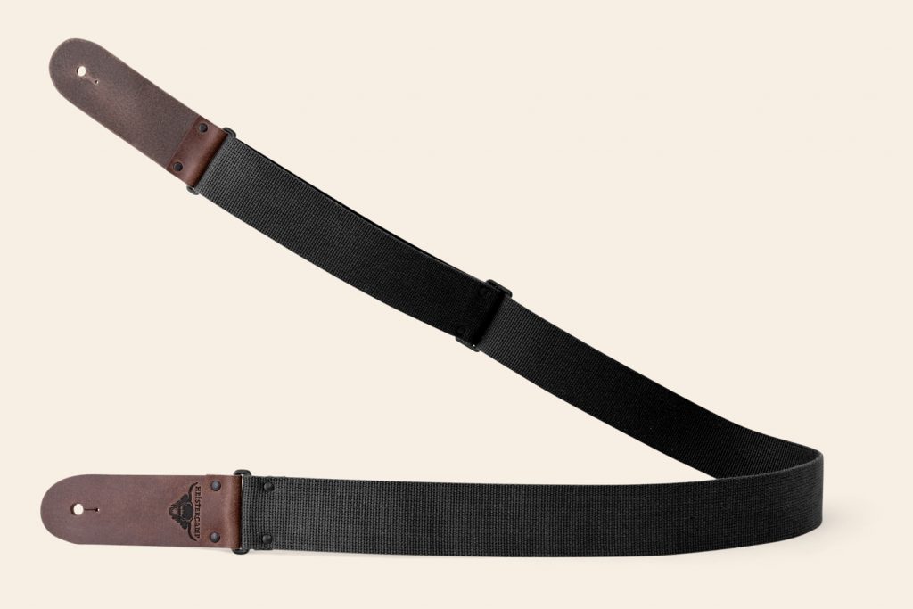 Black webbing guitar strap with Brown Pull Up ends