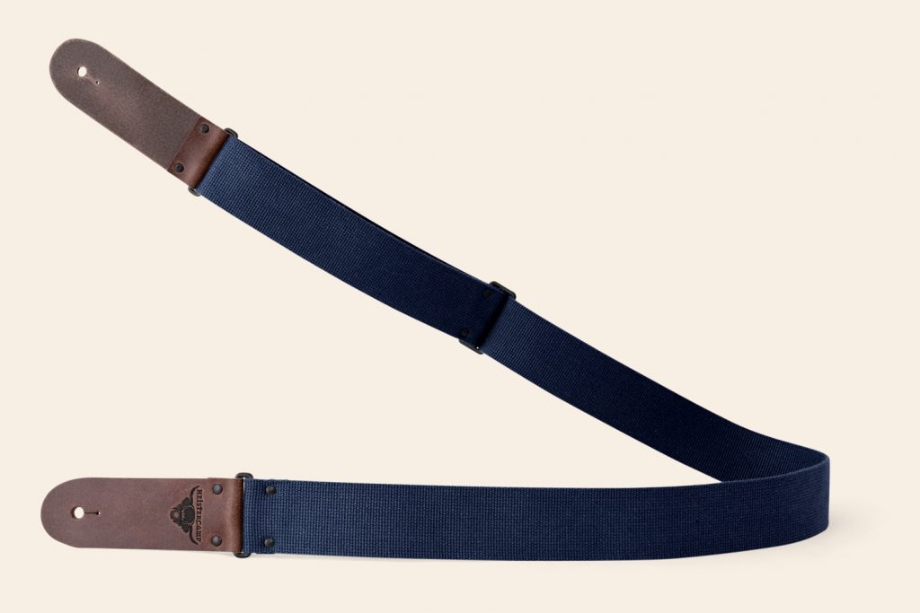 Navy webbing guitar strap with Brown Pul Up ends