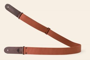Terracotta webbing guitar strap with Brown Pull Up ends